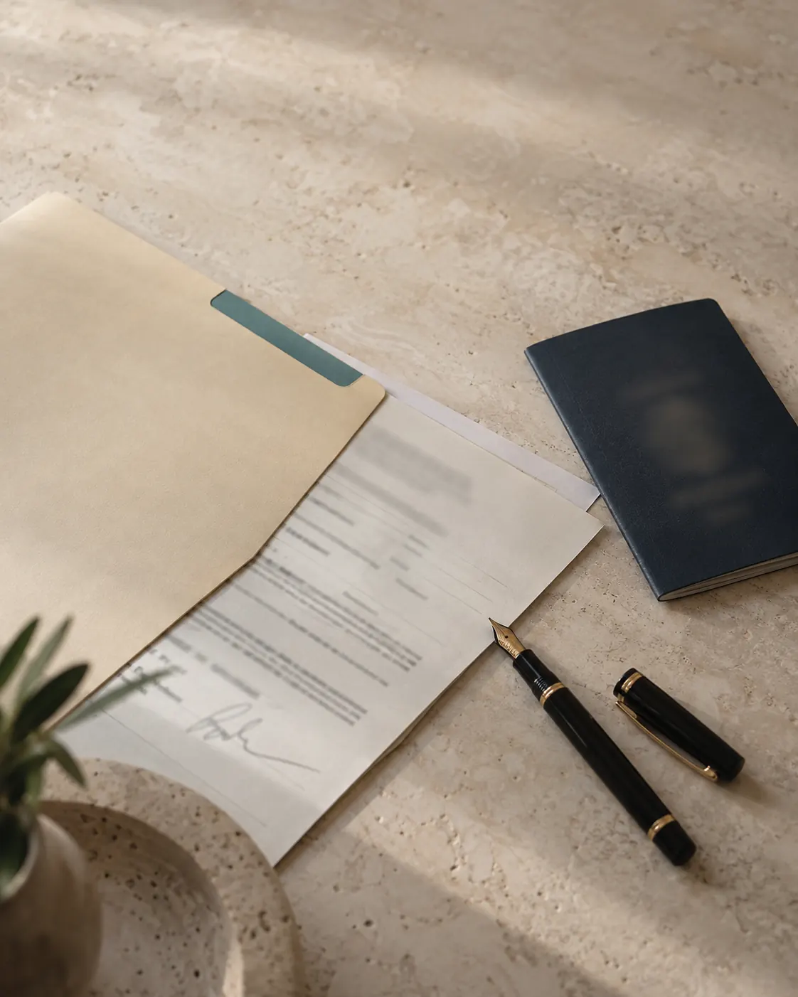 Company formation form in a folder with a fountain pen and passport on a stone desk